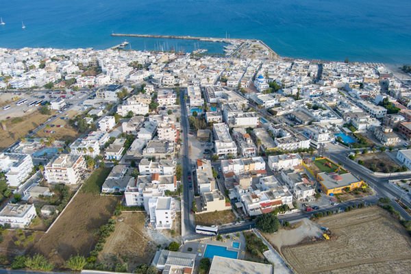 Aerial view of Kardamena town, its harbour and the Aegean Sea, Kos