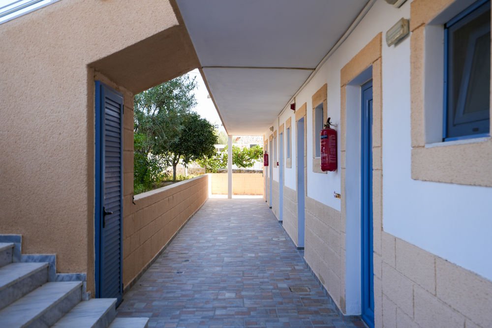 Covered walkway and steps leading to the ground-floor studios